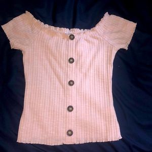 A pink top that is a low crop. Never worn